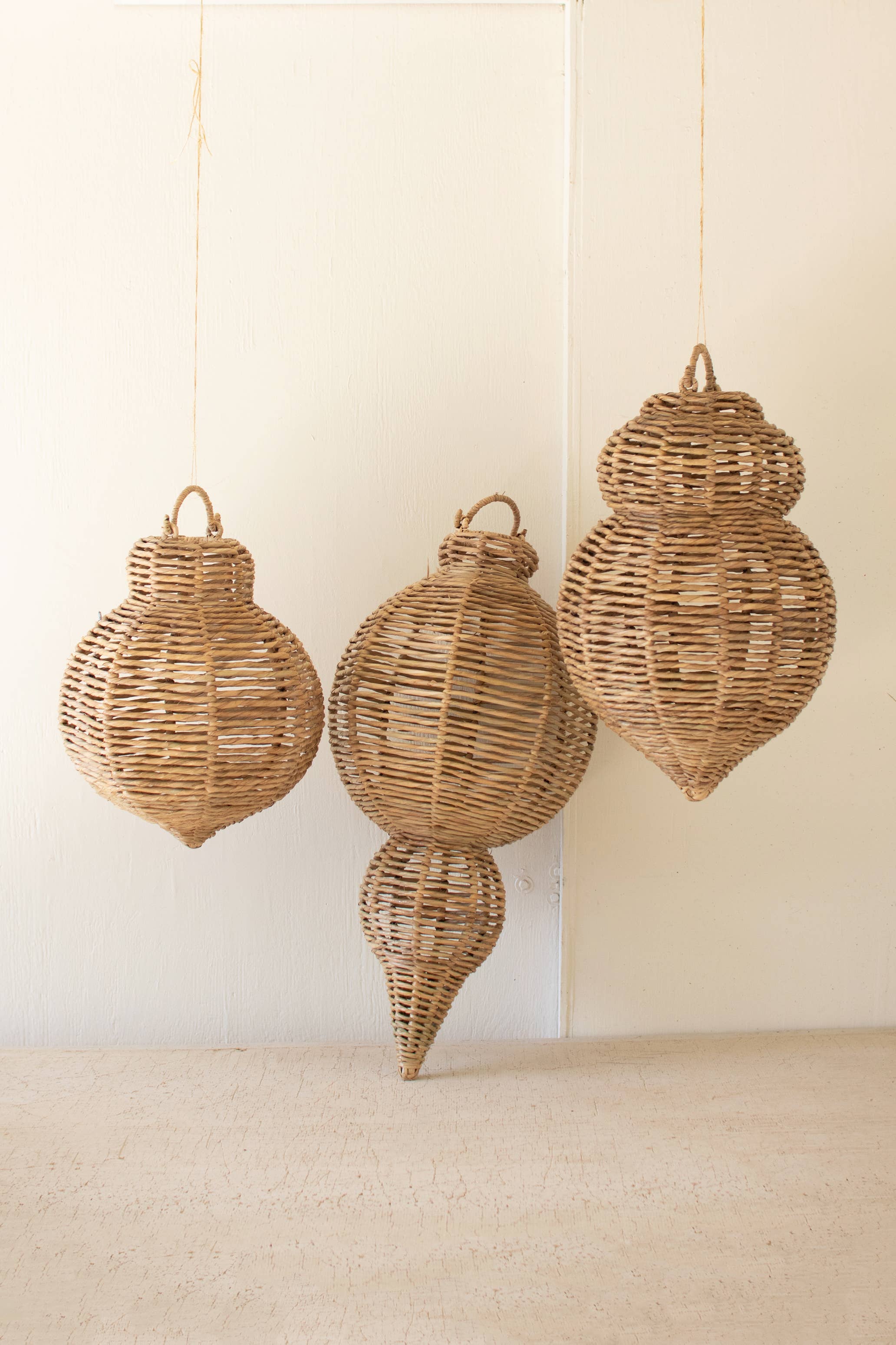 SET OF THREE LARGE WOVEN SEAGRASS AND IRON ORNAMENTS: Brown / Seagrass/Iron / Large: 14"d x 30.25"t;  
Medium: 12"d x 21"t;  
Small: 12"d x 17.75"t