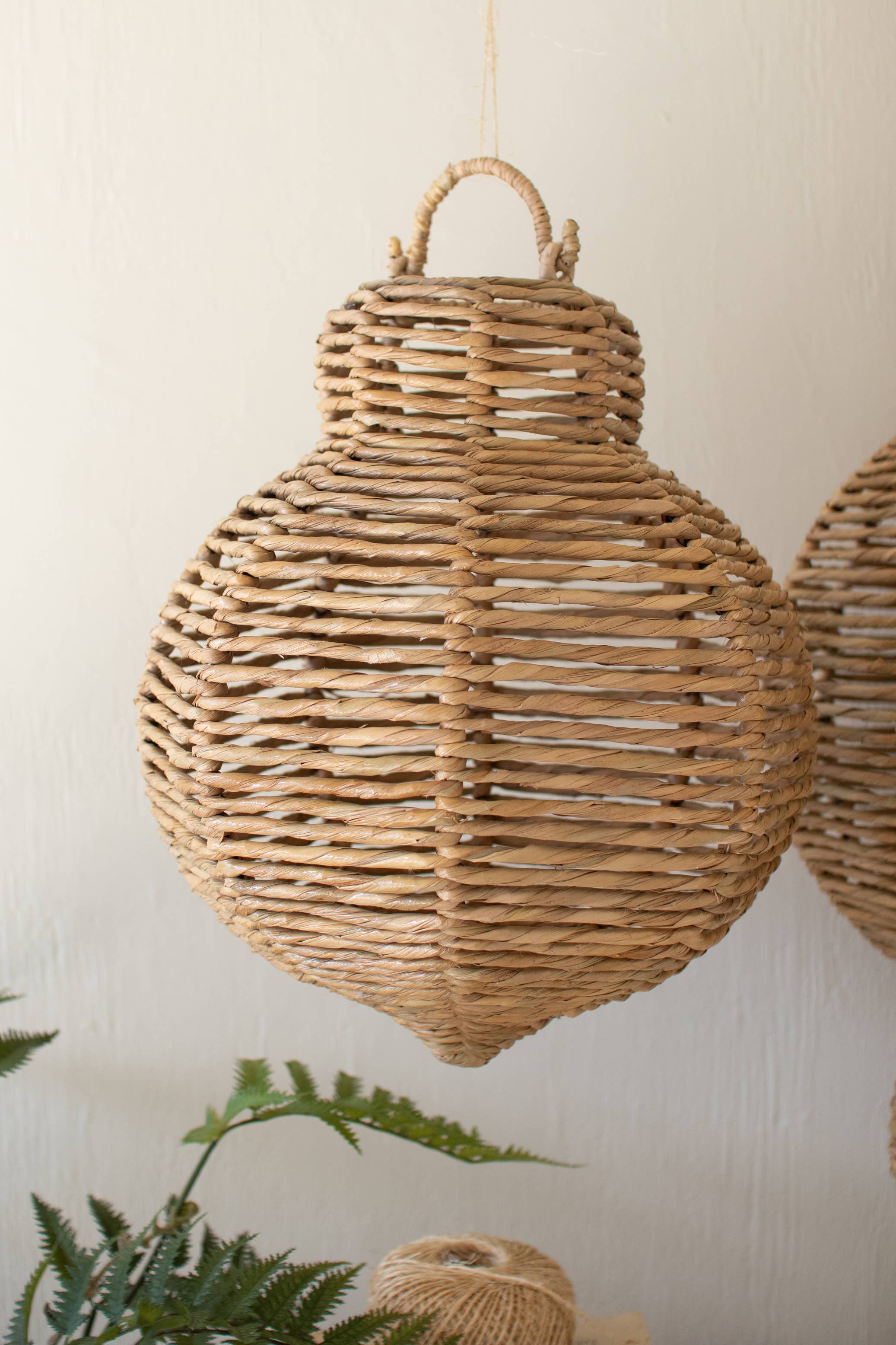 SET OF THREE LARGE WOVEN SEAGRASS AND IRON ORNAMENTS: Brown / Seagrass/Iron / Large: 14"d x 30.25"t;  
Medium: 12"d x 21"t;  
Small: 12"d x 17.75"t